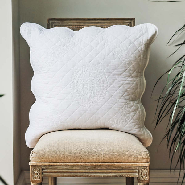Add this is pretty white  stitched quilted pillow sham cover together with a white quilted bedspread to complete and bedroom scheme.