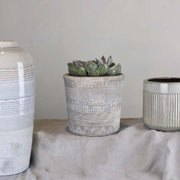 This cement  pot with its geometry pattern makes a great statement in your home, simple on its own or group it together with other designs.

