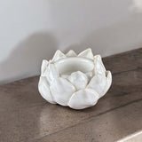 white ceramic lotus tea light