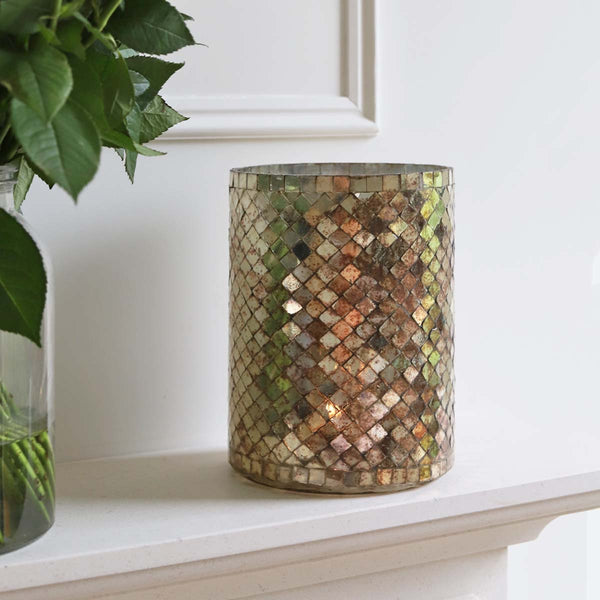<p>Handmade by artisans in India<p>

<p>This glass hurricane  looks beautiful both with and without a candle glowing inside. It’s a perfect addition to any decor. Have a cluster of holders to create a dazzling feel in your home. Stunning for use in living, hallways and outdoor spaces<p>

