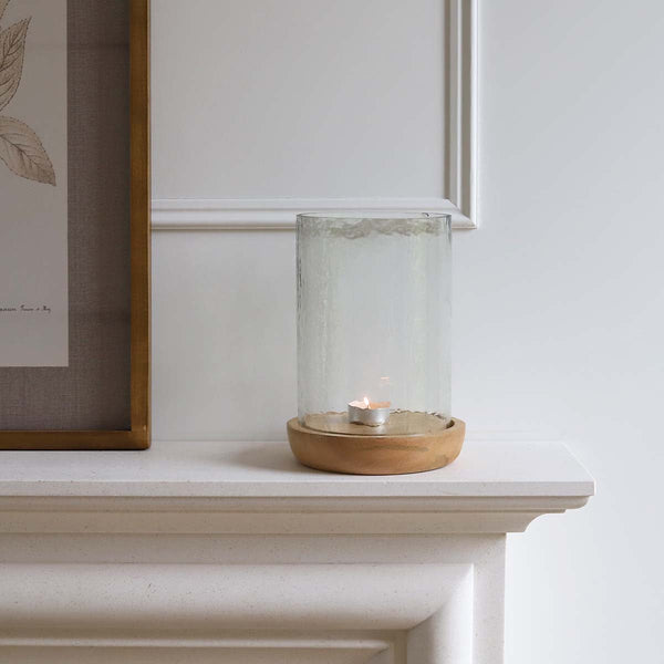 This stylish hurricane lamp will be lovely addition to your home or garden. The hand crafted wooden round base has been topped off with elegant recycled glass, place a candle inside and create a wonderful atmosphere.