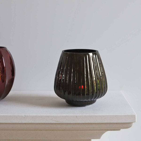 <p>Handmade by artisans in India<p>

<p>This glass tealight/votive holder looks beautiful both with and without a candle glowing inside. It’s a perfect addition to any decor. Have a cluster of holders to create a dazzling feel in your home. Stunning for use in living, hallways and outdoor spaces<p>

