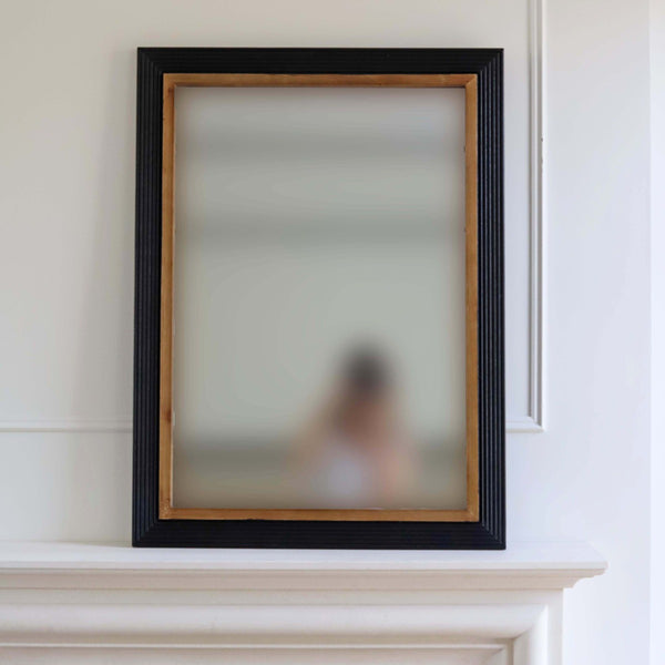 Create light and reflection with this two tone wooden framed mirror.