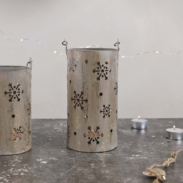 This versatile snowflake hurricane lamp can function as a centerpiece, or just add some extra glow to the corners of your house.