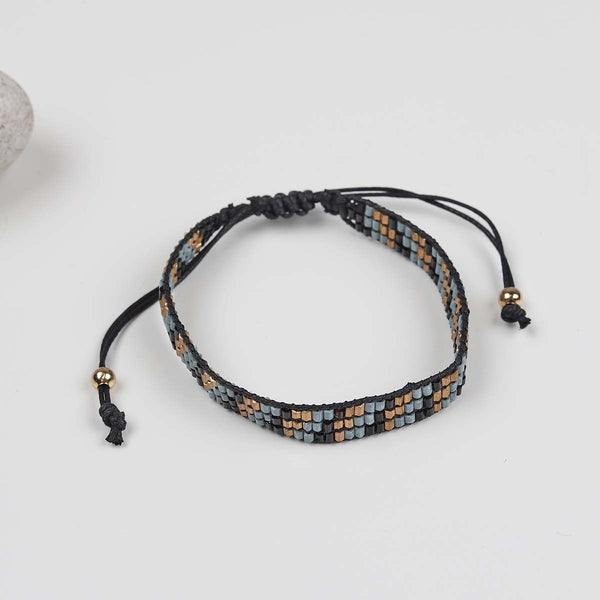 This handcrafted beaded loom bracelet is an great piece for any jewellery collection, in the colours of black,gold and grey, wear just the one or add a few bracelets together.

