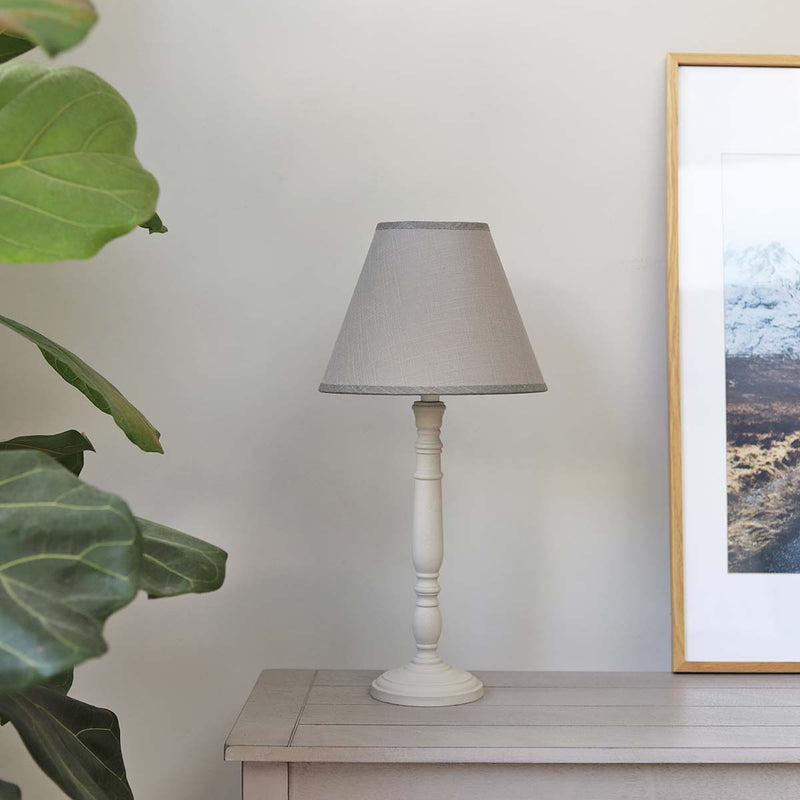 Light up your room in style with this elegantly shaped lamp & shade set, fabulously detailed with a distressed wood finish; a great accessory for adding a fresh touch to the home.


