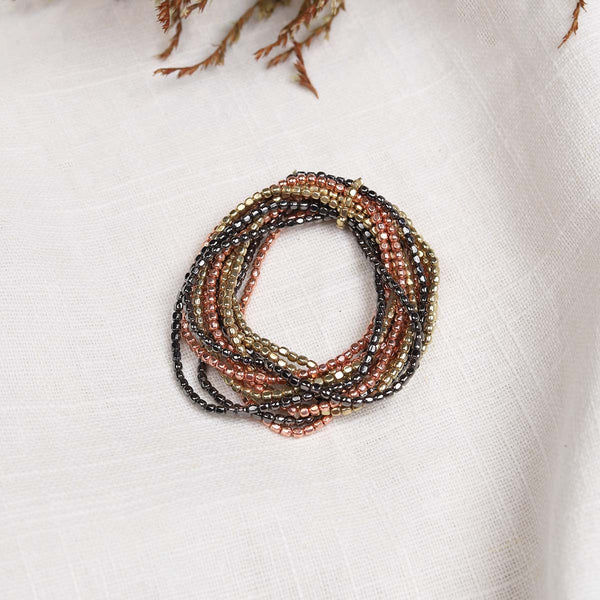 These handcrafted bracelets are 12 individual elasticated strands held together by a smaller strand ( not all loose and separate). A great piece for the jewellery box