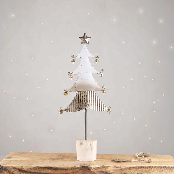 A festive grey and gold tree with gold bells and a star to top. Group a few trees together to make a great display.