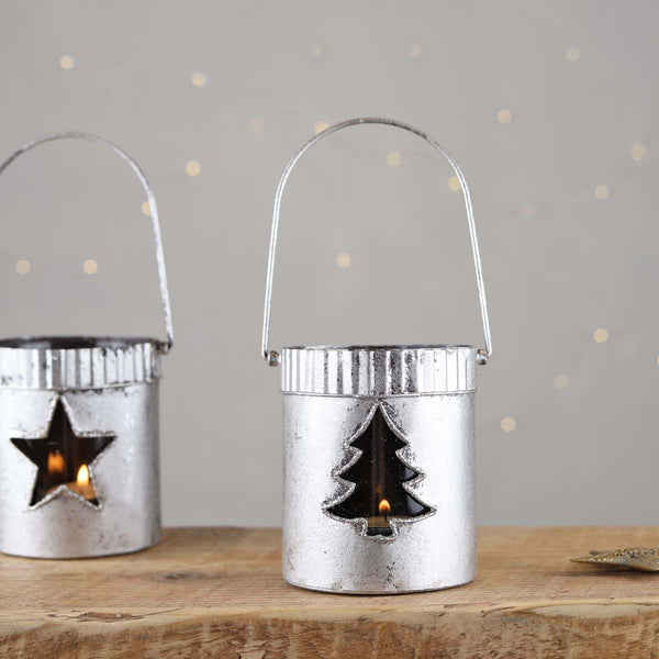 A great addition to your festive home, pop in a candle and let the light dance though the christmas tree, hang by the handle or stand on a mantlepiece or windowsill.