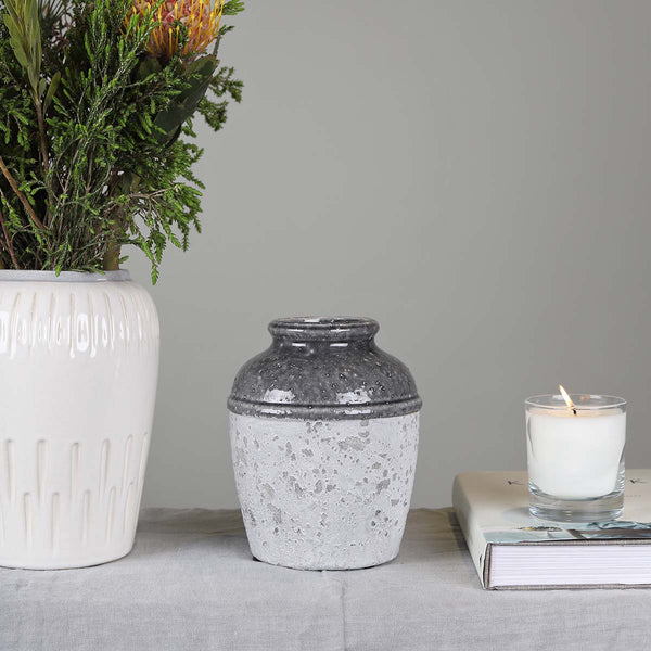 This cement vase with crackle glaze and a rustic paint finish would look great in any home.