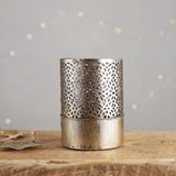 A stunning gold decorative candle holder with an inner glass, the light will dance through the cutout design.