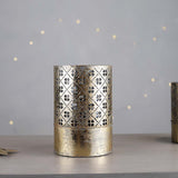 A stunning gold decorative candle holder with an inner glass, the light will dance through the cutout design.