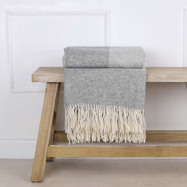 This soft and cosy 100% Australian wool throw with tassels, is just perfect over your legs, around your shoulders on cool evening, or as a runner at the end of the bed for a bit of extra warm