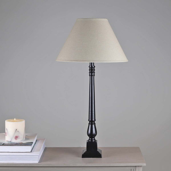 A real statement piece, this tall matt black base and shade gives this table lamp a contemporary touch.