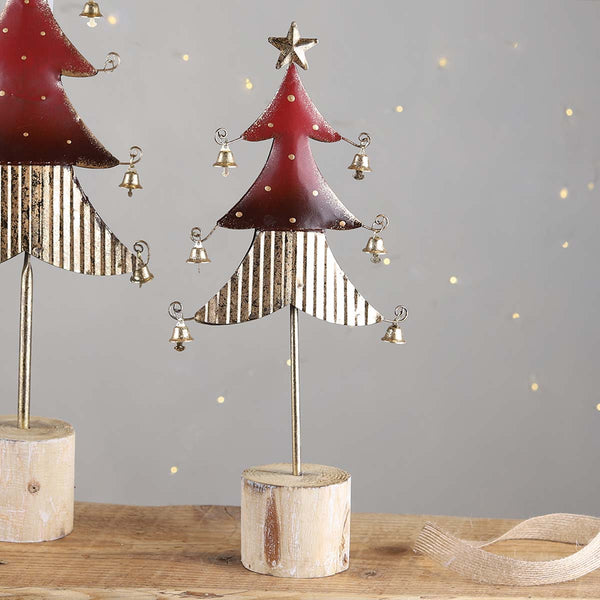 A festive red and gold tree with gold bells and a star to top. Group a few trees together to make a great display.