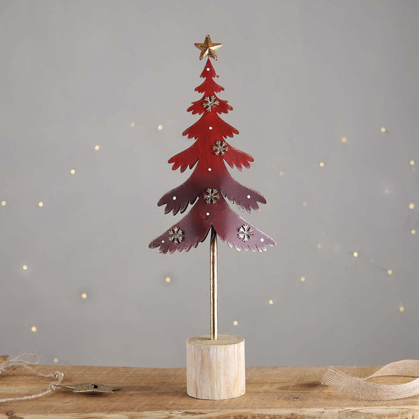 A festive red and gold tree with gold snowflakes and a star to top. Group a few trees together to make a great display.