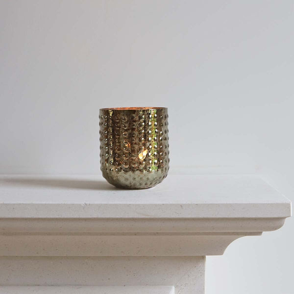 <p>Handmade by artisans in India<p>

<p>This glass tealight/votive holder looks beautiful both with and without a candle glowing inside. It’s a perfect addition to any decor. Have a cluster of holders to create a dazzling feel in your home. Stunning for use in living, hallways and outdoor spaces<p>





