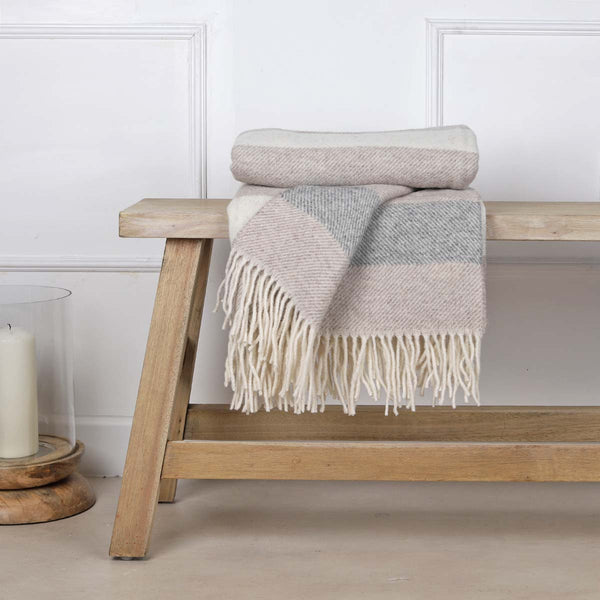 This soft and cosy 100% Australian wool throw with tassels, is just perfect over your legs, around your shoulders on cool evening, or as a runner at the end of the bed for a bit of extra warmth.