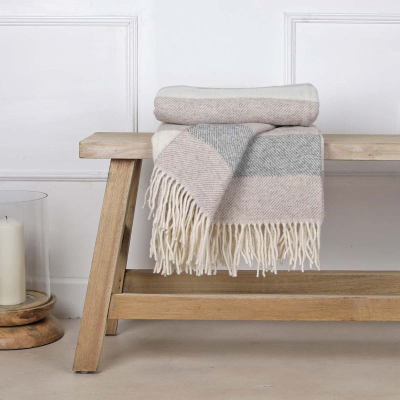 This soft and cosy 100% Australian wool throw with tassels, is just perfect over your legs, around your shoulders on cool evening, or as a runner at the end of the bed for a bit of extra warmth.