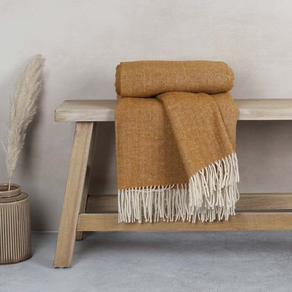 This soft and cosy 100% Australian wool throw with tassels, is just perfect over your legs, around your shoulders on cool evening, or as a runner at the end of the bed for a bit of extra warmth.