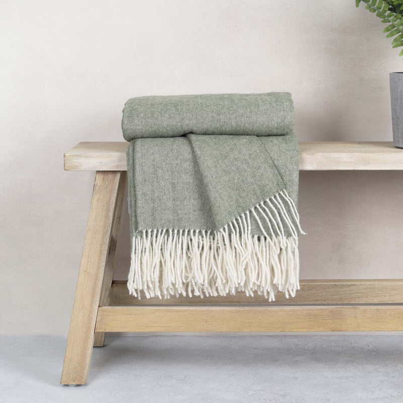 This soft and cosy 100% Australian wool throw with tassels, is just perfect over your legs, around your shoulders on cool evening, or as a runner at the end of the bed for a bit of extra warmth.