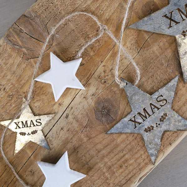 This rustic silver tin hanging garland is simply lovely, 1 large,1 medium , 1 small xmas star with 3 wooden white stars all on brown twine.